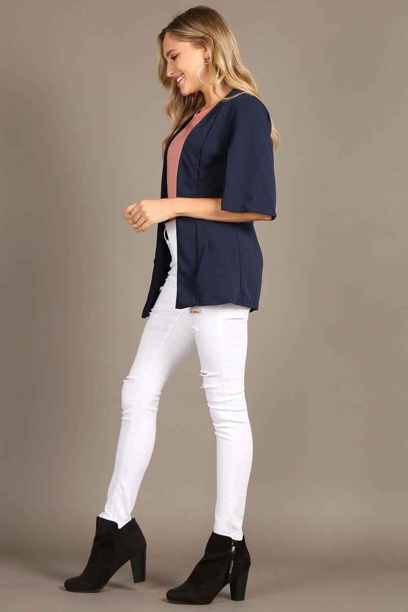 1245 Solid open coat with slit sleeves and a loose fit.
